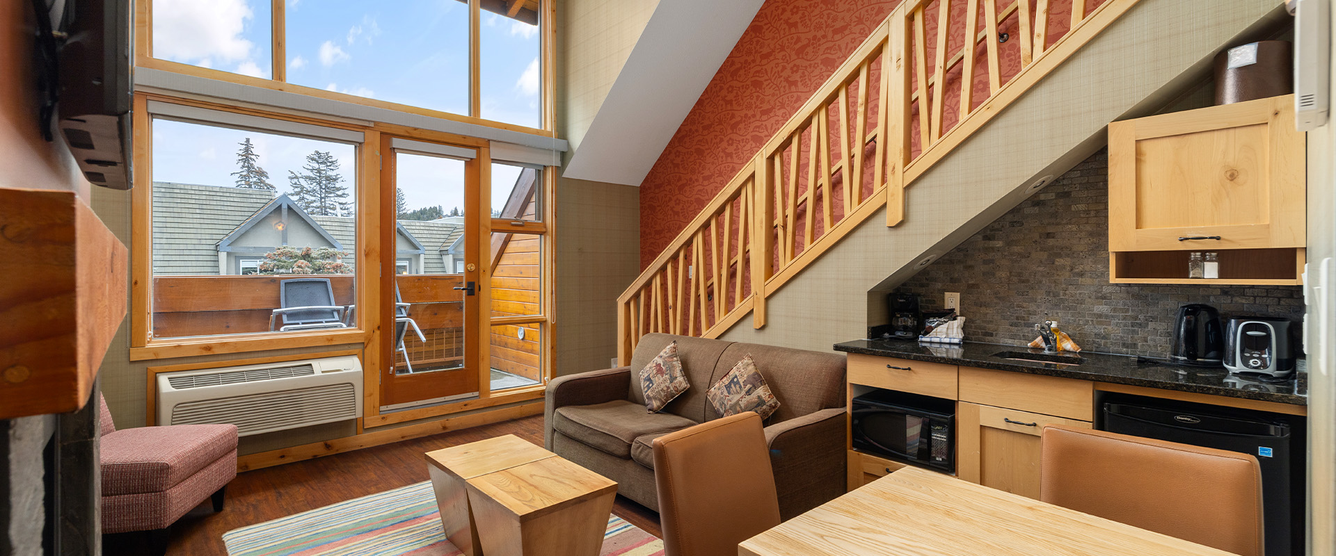 Living room in a Premium One Bedroom Plus Loft Suite at Fox Hotel & Suites in Banff