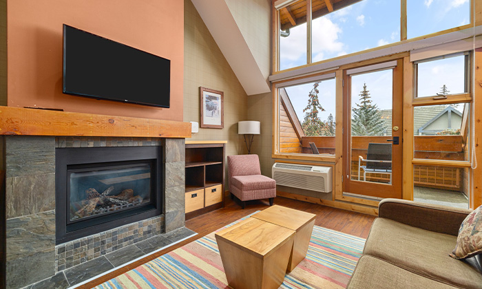 Living room in a Premium One Bedroom plus Loft Suite at Fox Hotel & Suites in Banff
