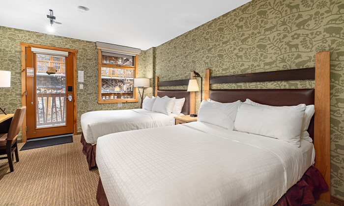Beds in a Hotel Room at Fox Hotel & Suites in Banff