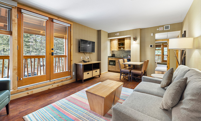 Living room in a Superior Two Bedroom Suite at Fox Hotel & Suites in Banff
